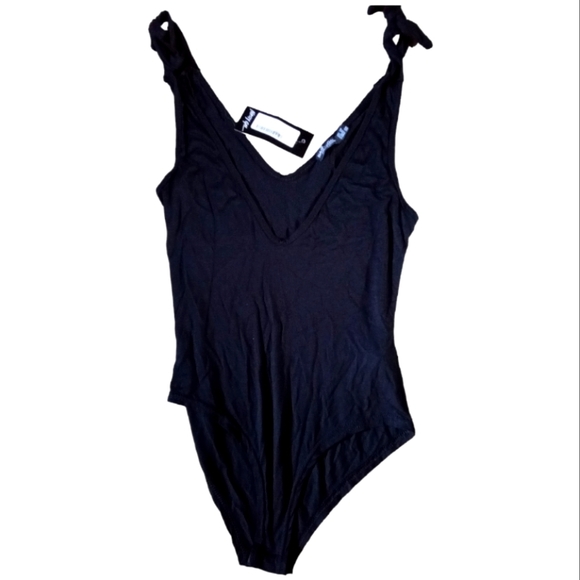 Nasty Gal Tops - NASTY GAL tie straps bodysuit size 6 new with tags